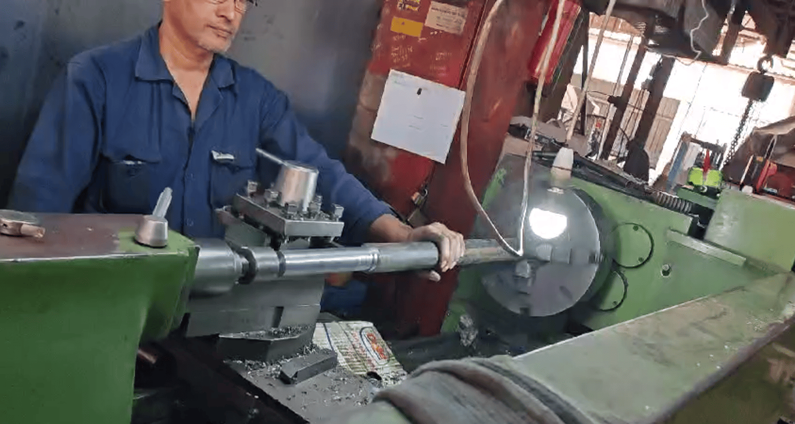 Worker handling industrial equipment